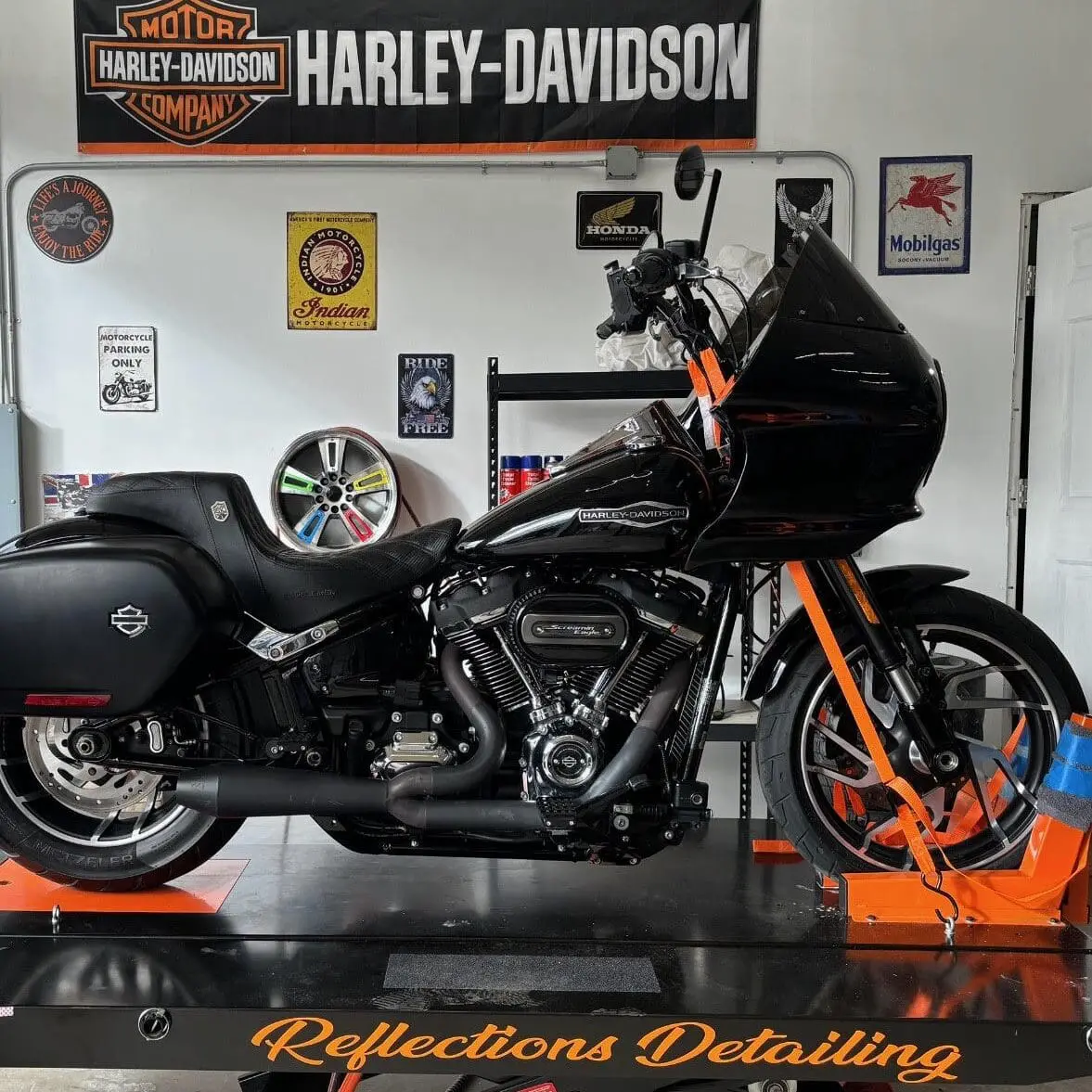 Shining Harley Davidson in a showroom at a vehicle detailing company in Auburn Maine
